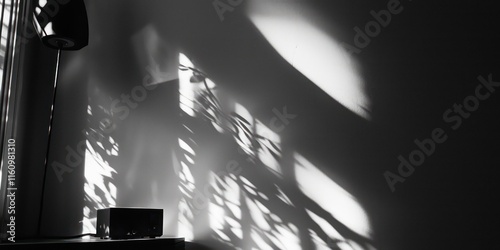 A nostalgic shot of old film being played through a projector, casting shadows on a blank wall. photo