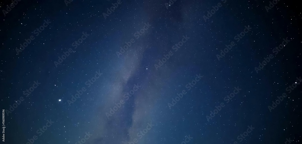 Fototapeta premium The night sky has shooting a star and the Milky Way in the background.