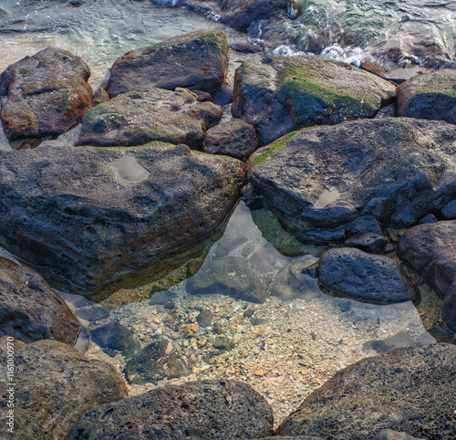 Rocks and a Tide Pool on Ala Moana Beach in Honolulu, Hawaii.