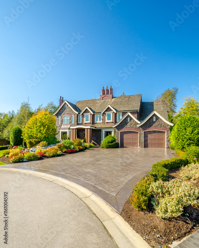 Two story luxury house with beautiful summer  landscape in Vancouver, Canada, North America. Day time on June 2024.