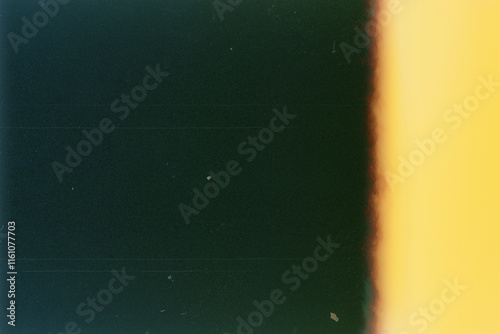 Fototapeta Naklejka Na Ścianę i Meble -  Blank grained film strip texture background with heavy grain, dust and light leak
