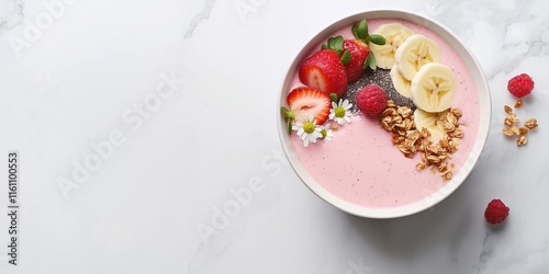 A bowl of fruit and granola with strawberries and raspberries. The bowl is on a white background