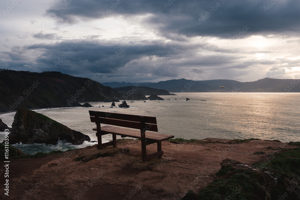 A quiet bench atop Loiba Cliffs, offering stunning ocean views and tranquility in Galicia, Spain. A quiet bench atop Loiba Cliffs, offering stunning ocean views and tranquility in Galicia, Spain.