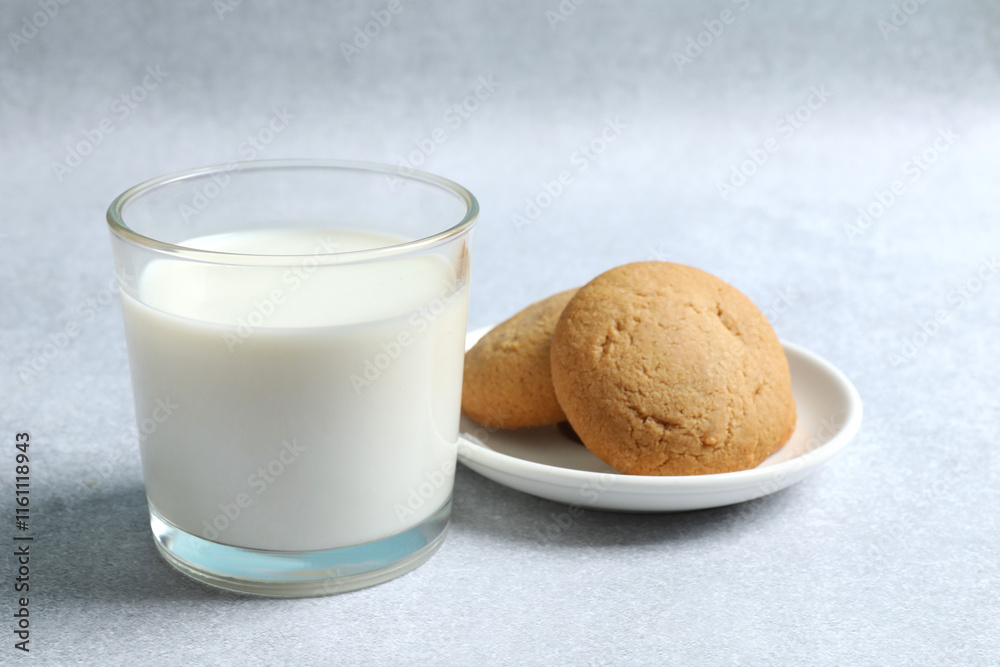 Glass of milk with cokies on the table Glass of milk with cokies on the table