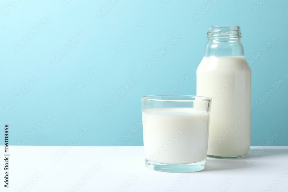 Glass of milk wiyh bottle on the table Glass of milk wiyh bottle on the table