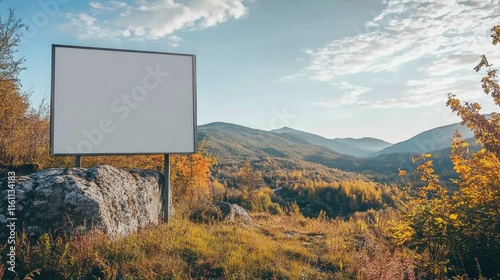 Blank billboard in scenic mountain landscape with autumn foliage. photo