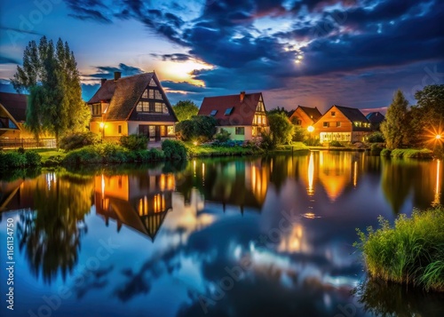 Dark, rural Wiedensahl pond at night. Low-light photography reveals the German countryside's serene beauty. photo