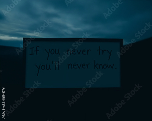 Motivational Quote Sign at Twilight. A motivational quote, 