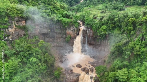 Amazing Waterfall in Sukabumi, a destination for many tourists as a place for recreation and photos. beautiful natural panorama of Waterfall Geopark Ciletuh
 photo