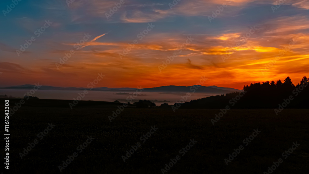 Foggy sunrise with dramatic clouds near Kirchberg im Wald, Regen, Bavarian Forest, Bavaria, Germany Foggy sunrise with dramatic clouds near Kirchberg im Wald, Regen, Bavarian Forest, Bavaria, Germany