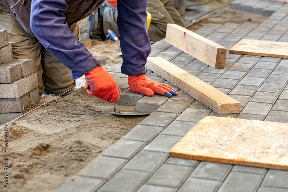 Crafting a durable pathway with precision during a sunny construction day