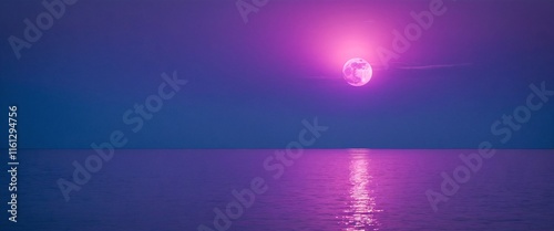 A full pinl moon rises over the ocean photo