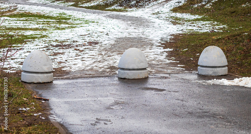 Cement barriers at the end of the road. Concept photo