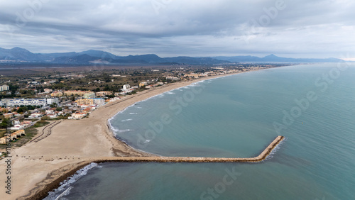 Les deveses beach with a breakwater photo