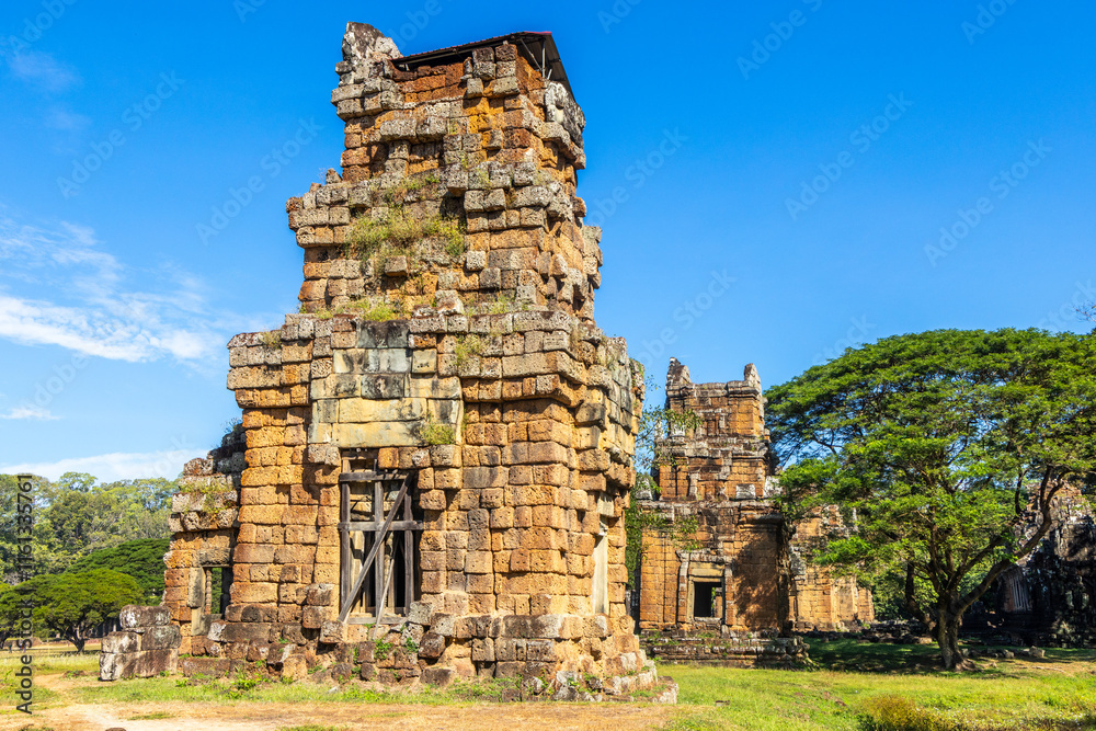 Row of ruined towers of ancient Prasat Suor Prat temple standing in the jungles,, Angkor Thom Archaeological Park, Siem Reap, Cambodia Row of ruined towers of ancient Prasat Suor Prat temple standing in the jungles,, Angkor Thom Archaeological Park, Siem Reap, Cambodia