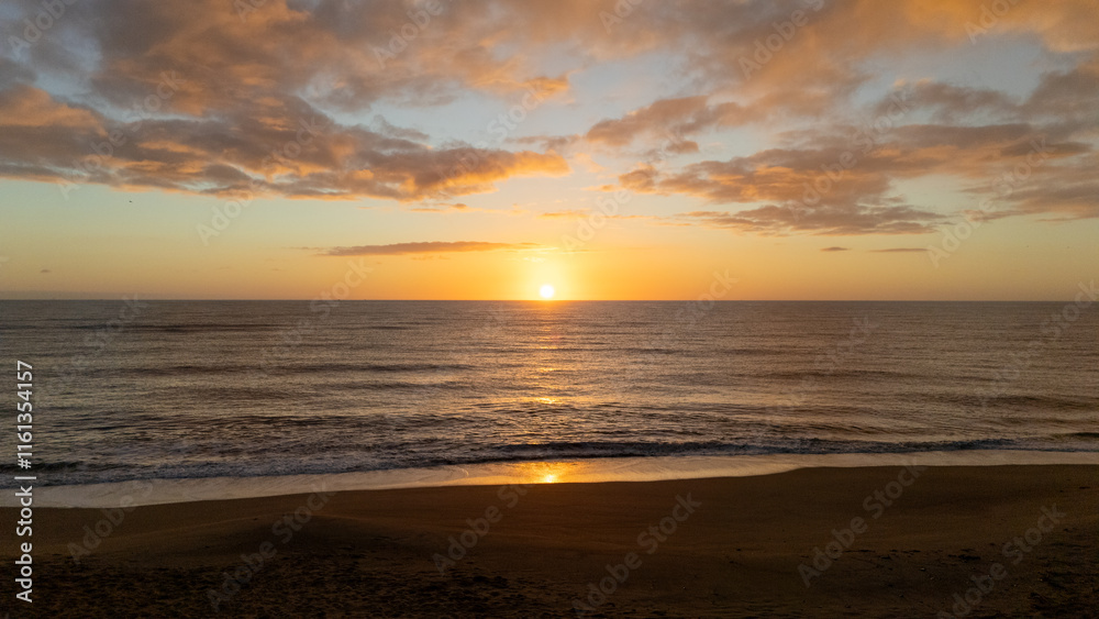 Drone aerial view of a sunset on a beach near Peniscola in Spain. Drone aerial view of a sunset on a beach near Peniscola in Spain.