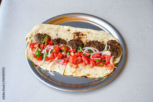 Meatball between bread (Turkish name : ekmek arasi kofte ) Izgara kofte. Manisa, Akcaabat, Akhisar  kofte. Delicious meat grilled meatballs. photo