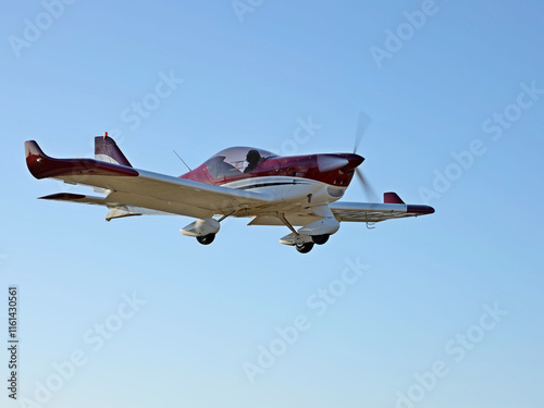 Yaslo, Poland - 9 3 2019: A light sport turboprop aircraft flies across the sky among the rainy clouds. Landing in difficult weather conditions. Meteorology and weather forecast for aviation