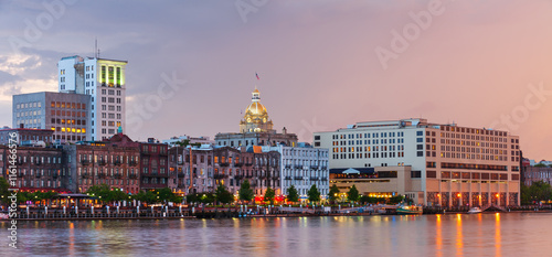 Panorama of illuminated waterfront Historic District at dusk, Savannah downtown, USA