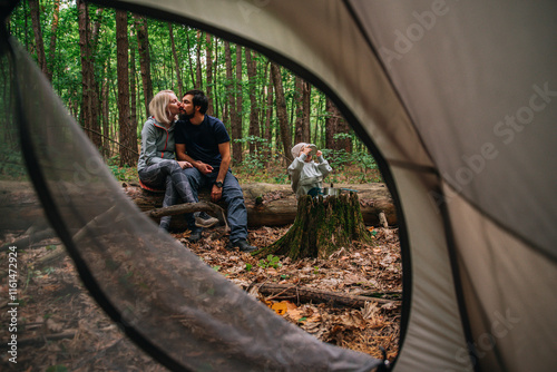 young family camping with a tent