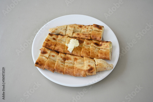 Kiymali pide. Turkish pide with minced meat. Turkish pizza mince pita Pide on white background. Etli ekmek. Kusbasi kasarli, kiymali kasarli, kiymali yumurtali, Bafra, Trabzon, Kusbasili pide. photo