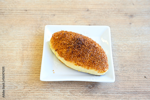 Turkish pastry product , tasty pogaca. Simit, gevrek. Turkish Pastries; peynirli, patatesli, kasarli pogaca, borek, acma, ay coregi at patisserie showcase. photo