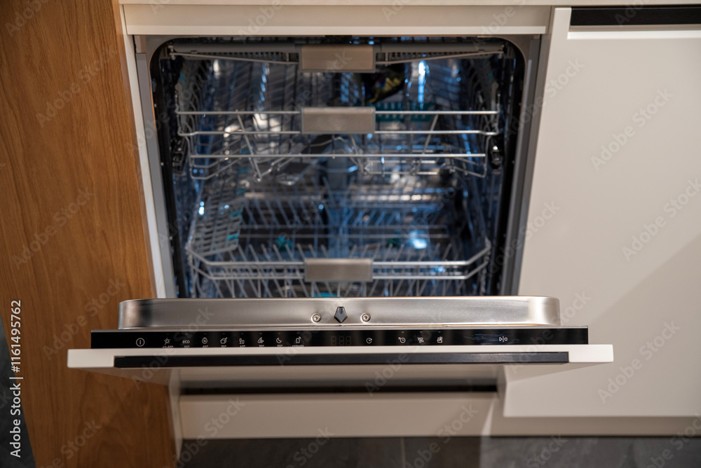 Built-in dishwasher with open door and control panel Built-in dishwasher with open door and control panel