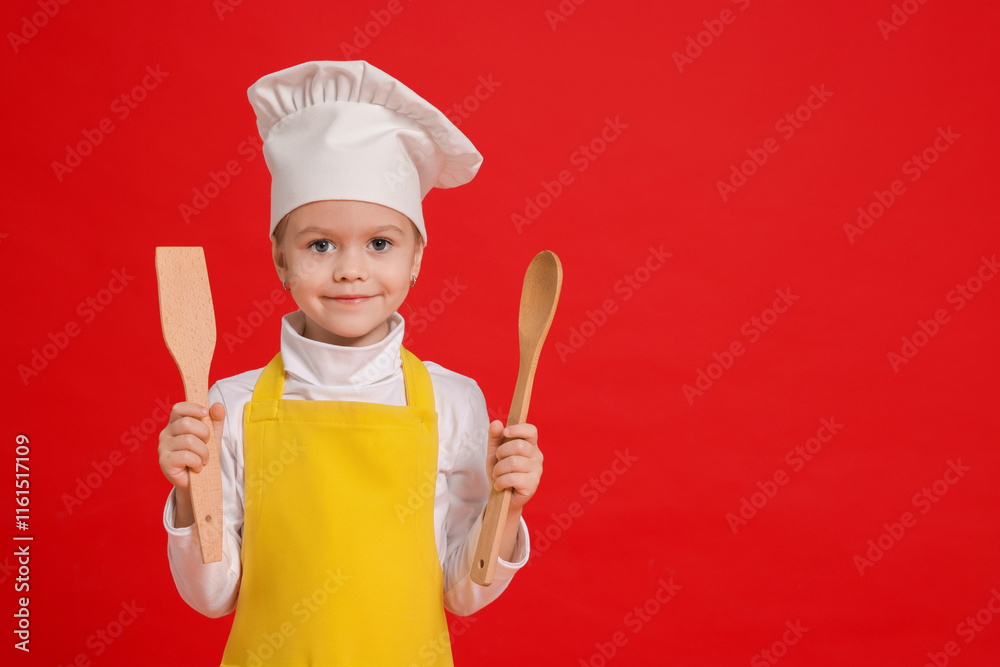 Little girl with utensils pretending to be chef on red background, space for text. Dreaming of future profession Little girl with utensils pretending to be chef on red background, space for text. Dreaming of future profession