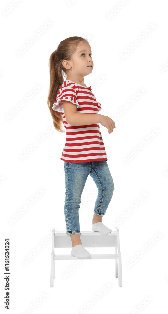 Little girl standing on step stool against white background Little girl standing on step stool against white background