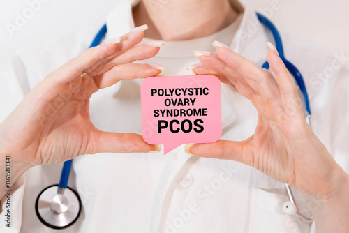 PCOS Polycystic ovary syndrome written in spiral notebook on doctor desk.