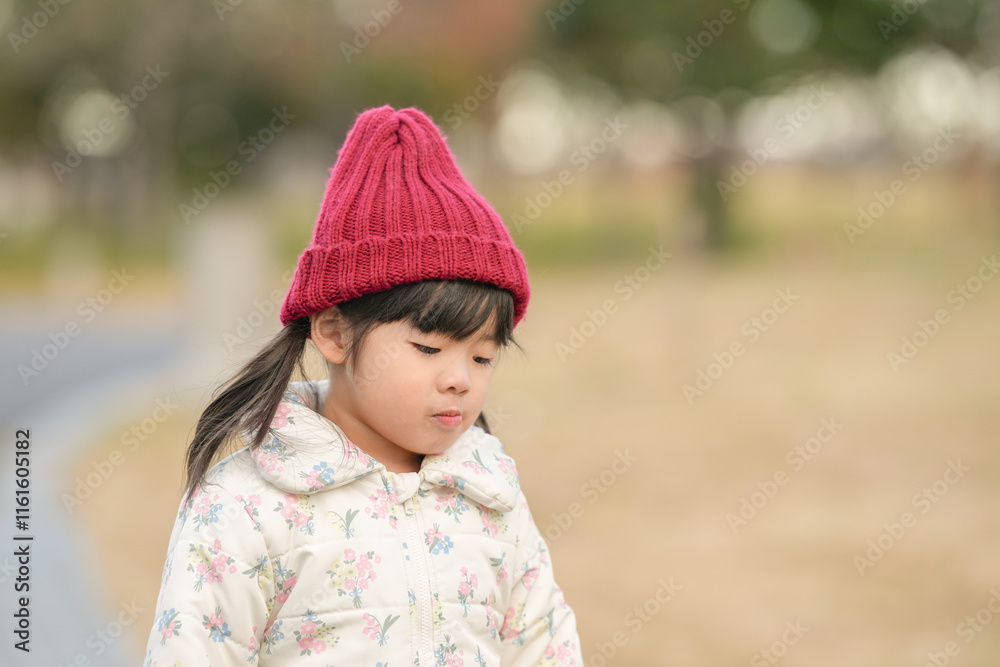 A 3-year-old Japanese girl is walking on a cold winter night in a seaside park in Hakata, Fukuoka Prefecture. A 3-year-old Japanese girl is walking on a cold winter night in a seaside park in Hakata, Fukuoka Prefecture.