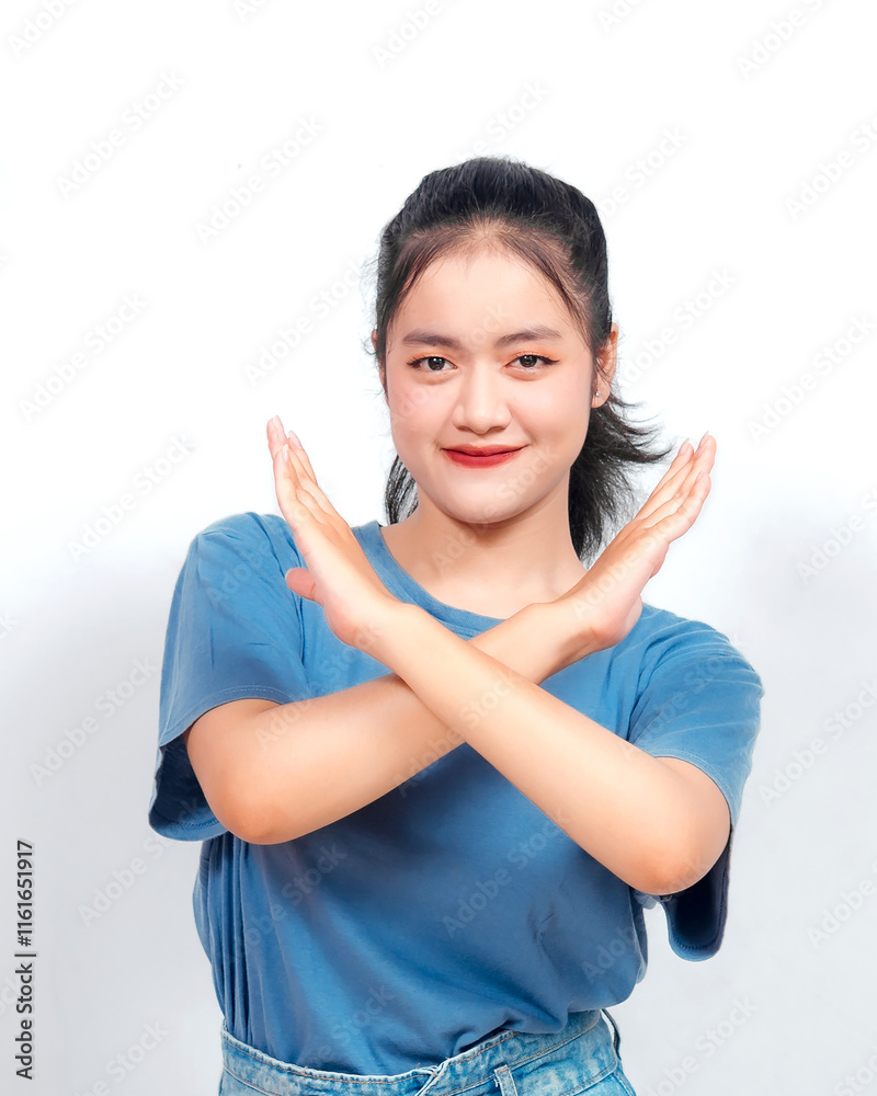 Stop. Concerned Asian woman showing refusal sign, saying no, raise awareness, standing over white background Stop. Concerned Asian woman showing refusal sign, saying no, raise awareness, standing over white background