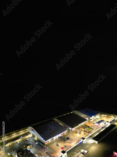 Aerial View of Illuminated Brighton Beach and Ocean City and British Tourist Attraction of East Sussex, England Great Britain During Night. Drone's Camera Footage Captured on December 3rd, 2024 photo