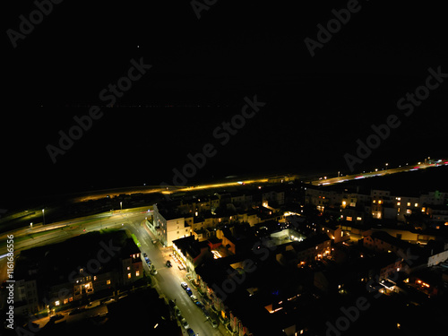 Aerial View of Illuminated Brighton Beach and Ocean City and British Tourist Attraction of East Sussex, England Great Britain During Night. Drone's Camera Footage Captured on December 3rd, 2024 photo