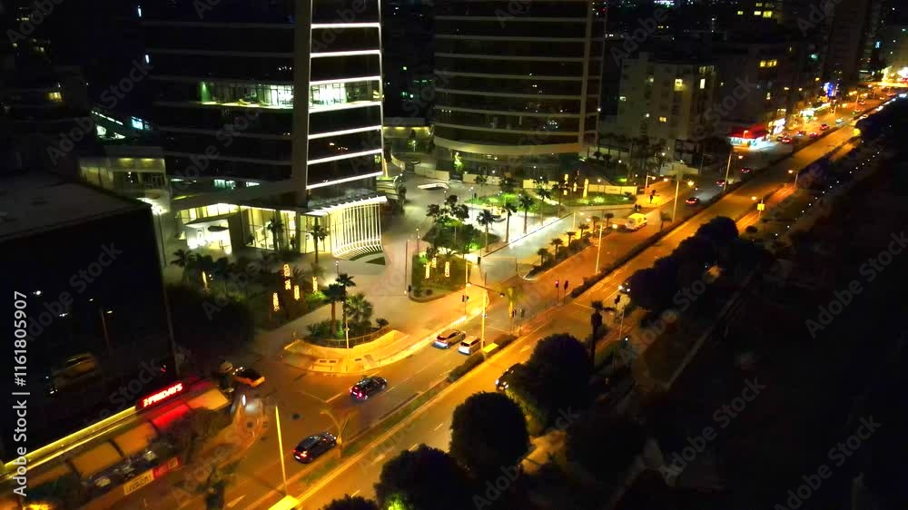 Aerial exploration of Limassol's illuminated urban charm, modern architecture and traffic. High quality 4k footage. Cyprus, Mediterranean Sea