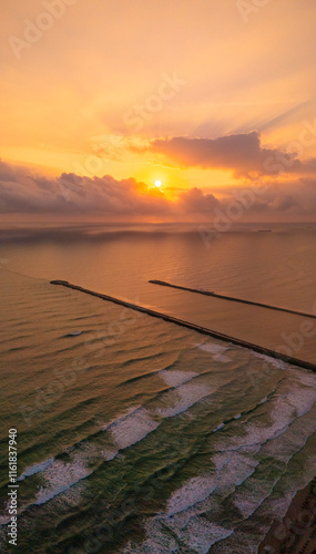 Beautiful view of the Panuco River flowing into the Gulf of Mexico Sea at sunrise. Its fresh waters are guided by the docks of Tampico and Veracruz. photo