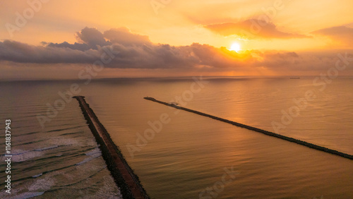 Beautiful view of the Panuco River flowing into the Gulf of Mexico Sea at sunrise. Its fresh waters are guided by the docks of Tampico and Veracruz. photo