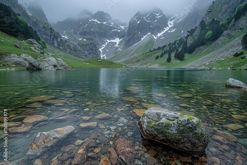 A mountain lake with surrounding peaks and peaceful atmosphere photo