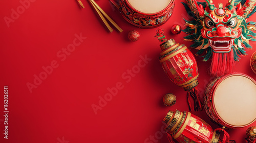 Top view of dragon dance props drums, masks on a red background photo