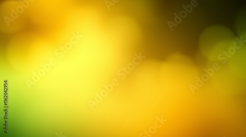 Abstract blurred green and yellow gradient background creating soft bokeh effect