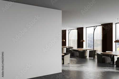 Modern interior featuring a blank wall with a stylish dining area in the background illuminated by natural light and pendant lamps. 3D Rendering photo