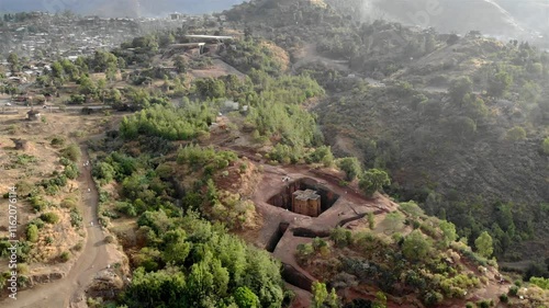 Aerial footage over Saint George Cross shaped rock hewn, Ethiopia
Drone view Saint George Cross shaped rock hewn church, Lalibela, Ethiopia 
