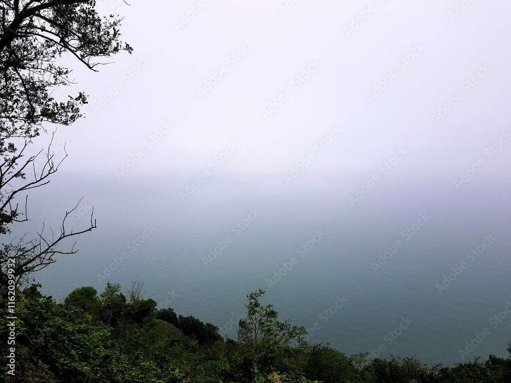 Beautiful landscape of sea and mountain in fog at Phuket, Thailand Beautiful landscape of sea and mountain in fog at Phuket, Thailand