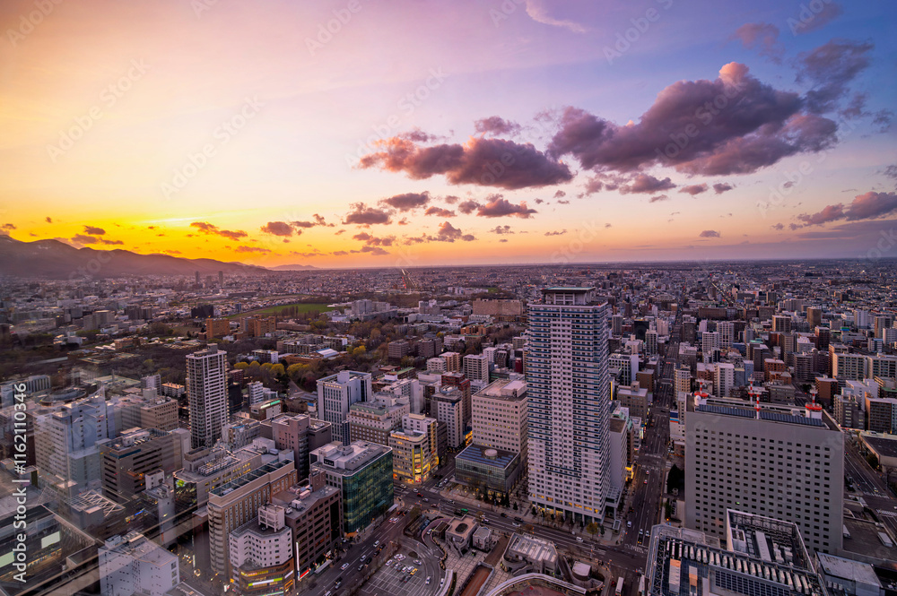 sunset or sun rise of Sapporo cityscape with Skyline and office building and downtown of sappiro is populars ciy from toursim Hokkaido, Japan with twilight sky in spring season
