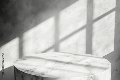 Marble pedestal in sunlit room.