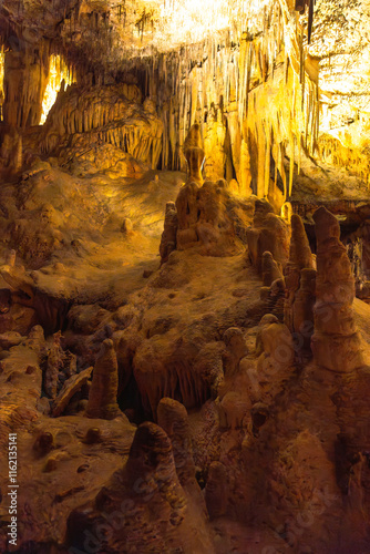 Stalactites and stalagmites creating majestic formations in drach caves photo