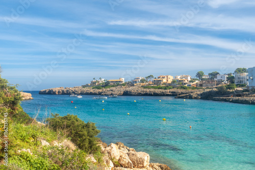 Cala domingos beach embraces turquoise waters on mallorca island coastline photo