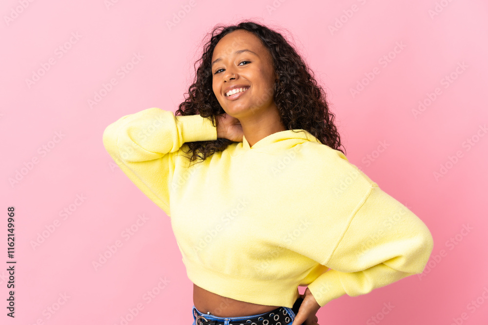 Teenager cuban girl isolated on pink background laughing Teenager cuban girl isolated on pink background laughing