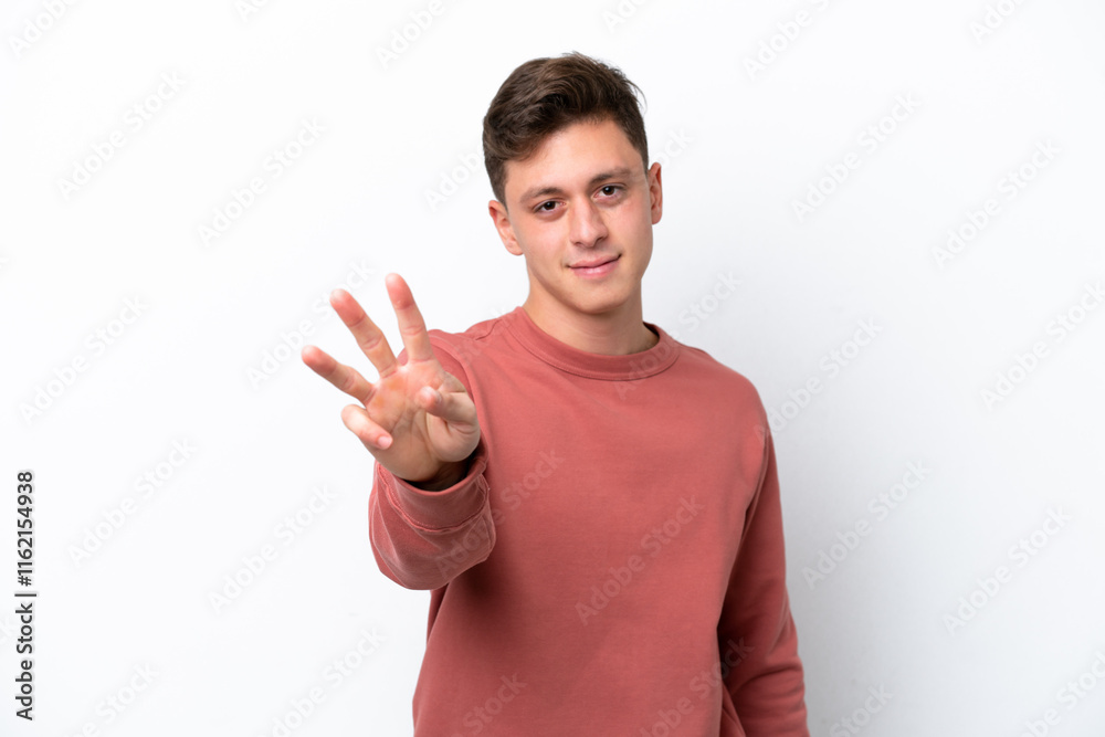 Young handsome Brazilian man isolated on white background happy and counting three with fingers Young handsome Brazilian man isolated on white background happy and counting three with fingers