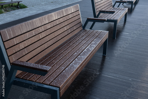 LANDSCAPE BY LAKE - Benches on the viewing and recreational platform in the morning dew